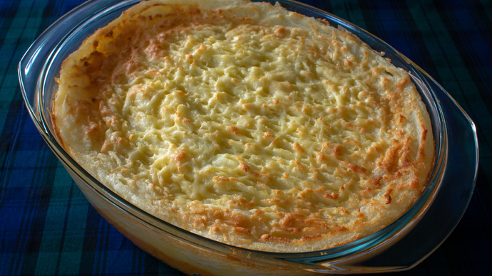 A mashed potato topped baked pie filled with haggis