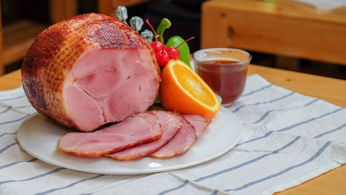 Joint of sliced gammon plated on a table