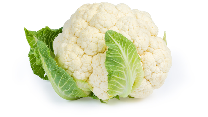 A head of white cauliflower with a couple of leaves