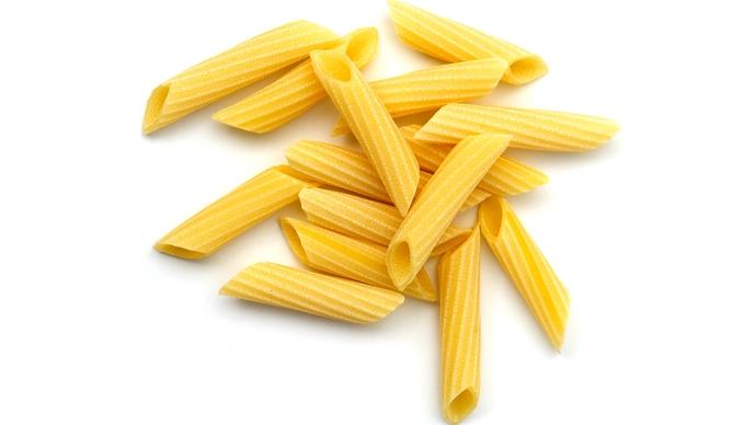 a small pile of dried penne pasta