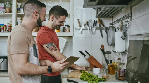 Two lads cooking together in the kitchen