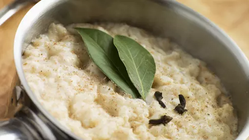 Bowl of creamy bread sauce with garnish