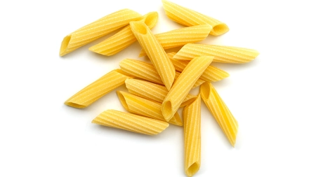 a small pile of dried penne pasta