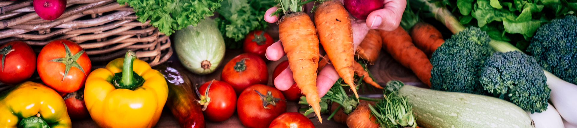 A spread of lovely fresh brightly coloured summer vegetables 